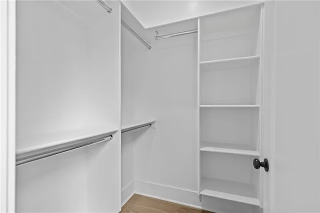 a view of a hall with wooden floor