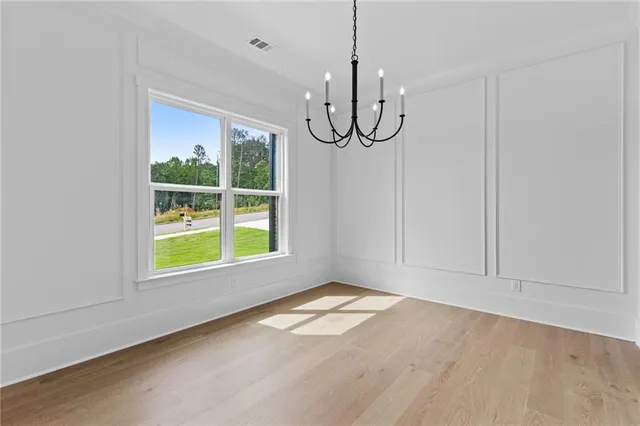a view of room with window and hardwood floor