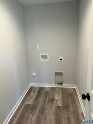 a view of a room with wooden floor