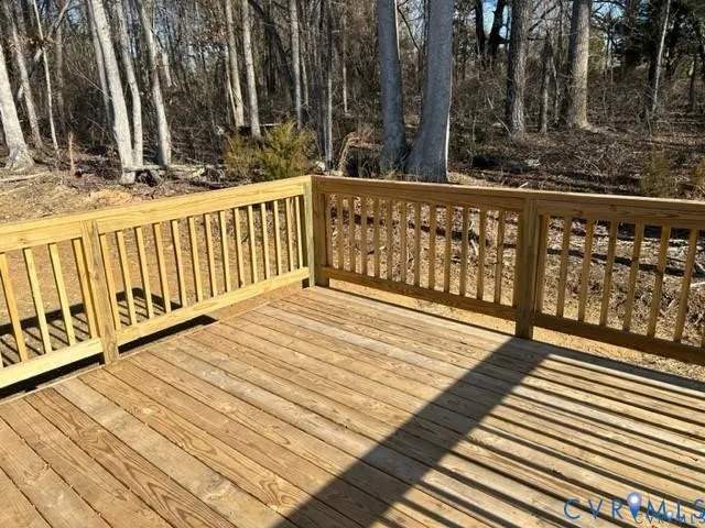 view of balcony with wooden floor and fence
