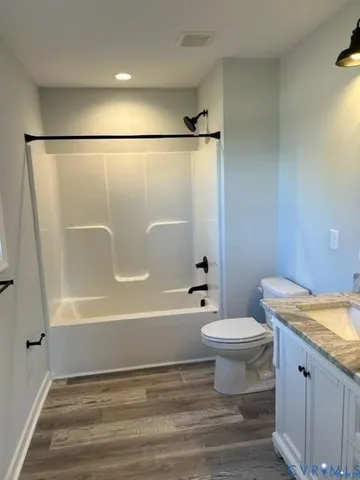 a bathroom with a sink a toilet and a bathtub