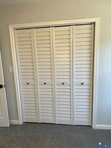 an empty room with a wooden floor