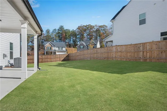 a view of a back yard of the house