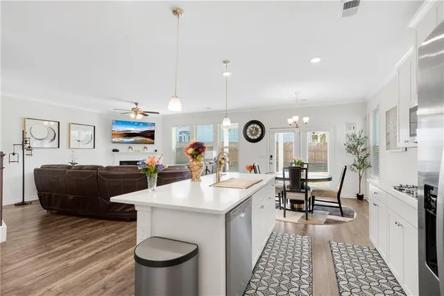 a living room with furniture a rug and a fireplace