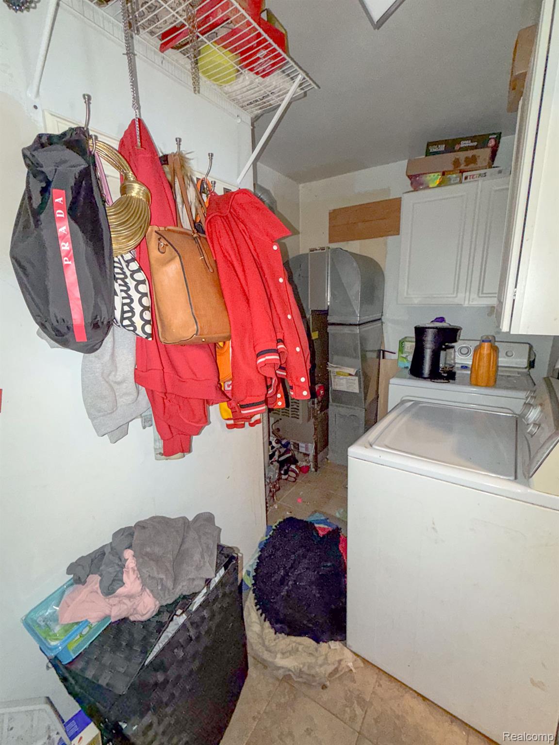 24811 Valley Avenue Eastpointe, MI 48021 - Photo 15 of 22 Laundry room featuring washing machine and clothes dryer and cabinet space