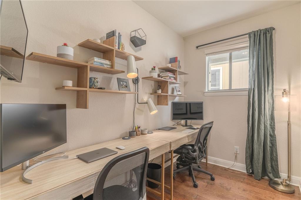 6708 Menchaca Road, Unit 14 Austin, TX 78745 - Photo 11 of 22 Dedicated workspace featuring wood-finish flooring and neutral wall tones