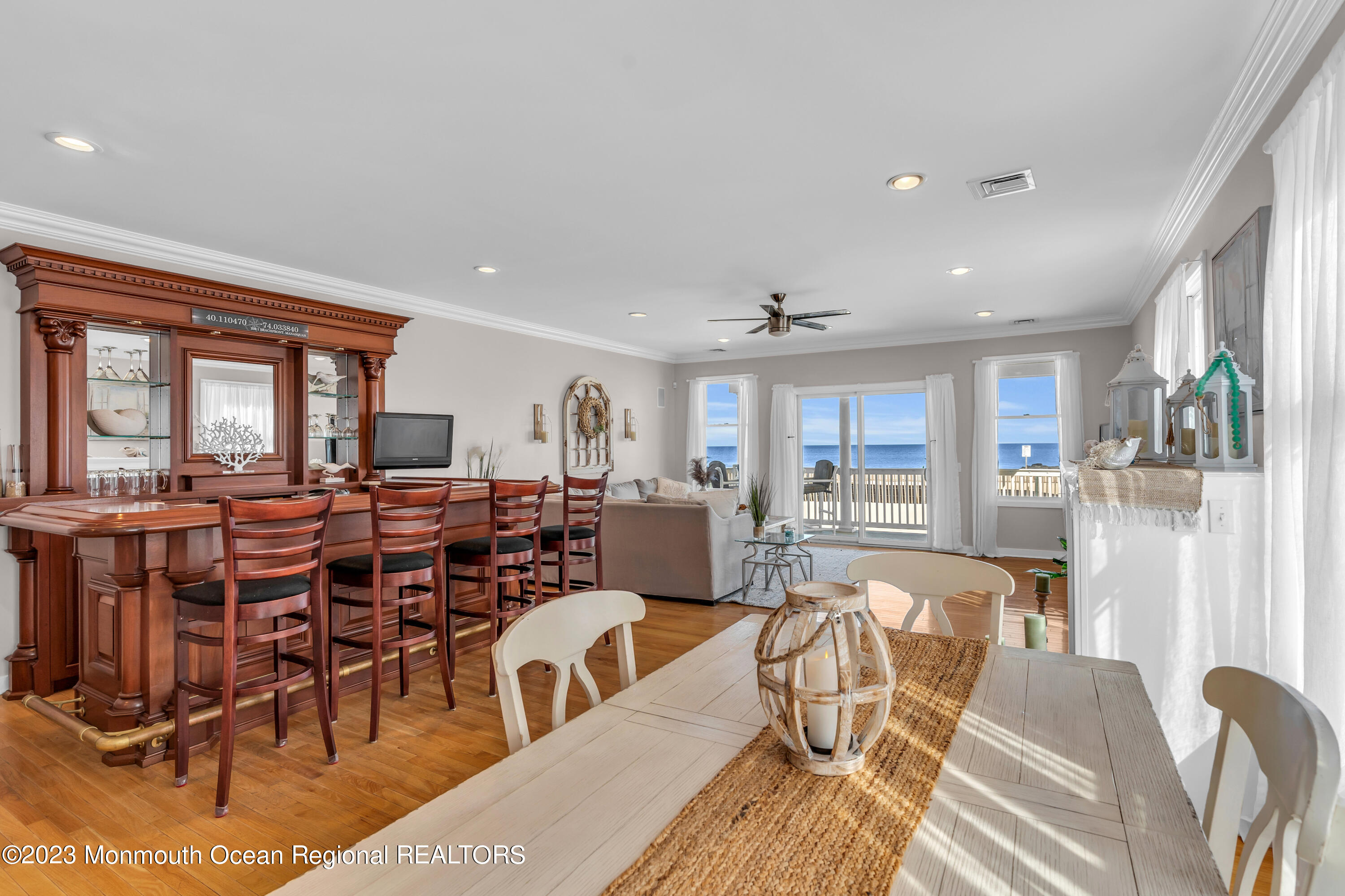 239 Beach Front, Unit 1 Manasquan, NJ 08736 - Photo 11 of 31 a living room with lots of furniture and a large window
