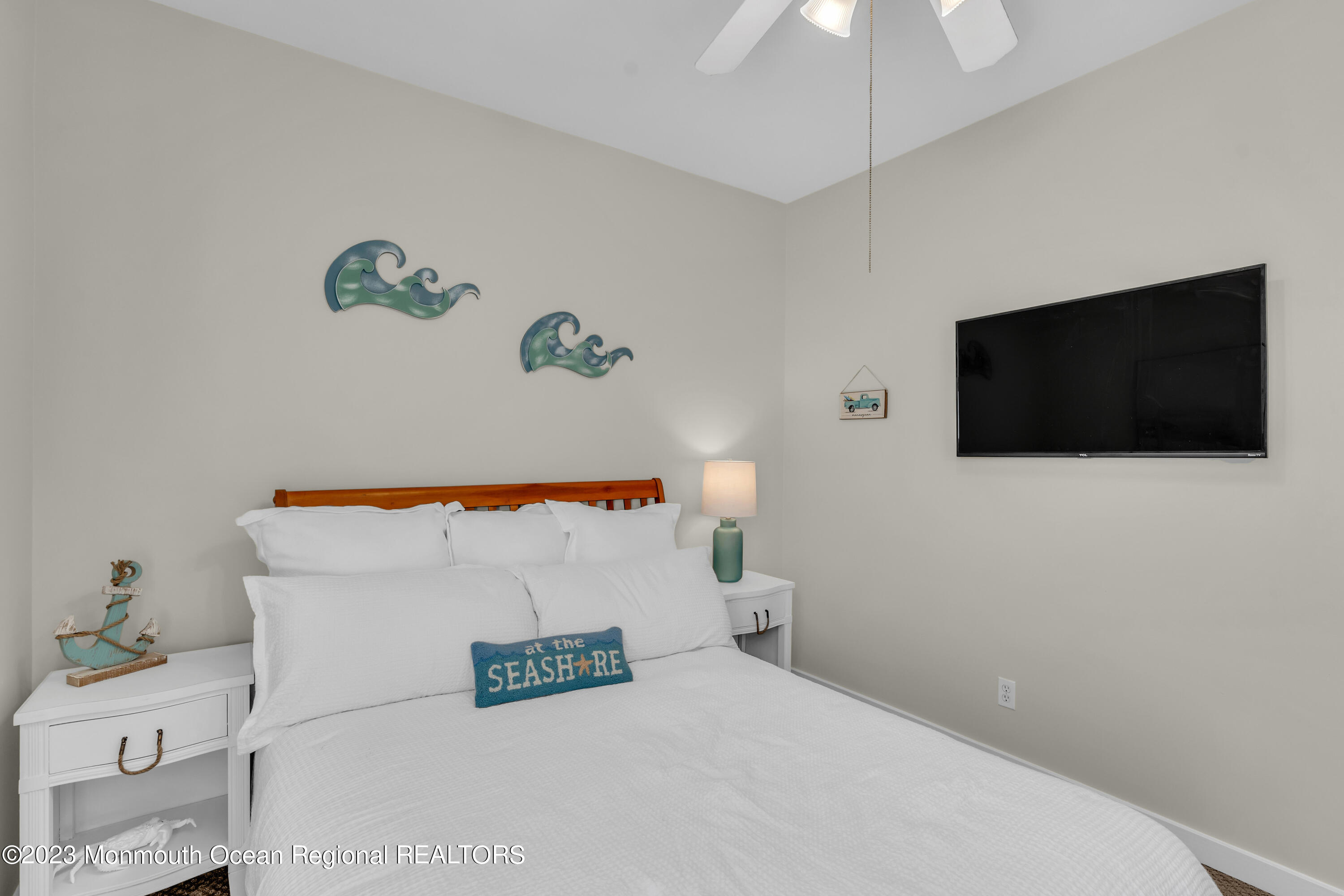 239 Beach Front, Unit 1 Manasquan, NJ 08736 - Photo 23 of 31 a bathroom with a bathtub and a flat screen tv