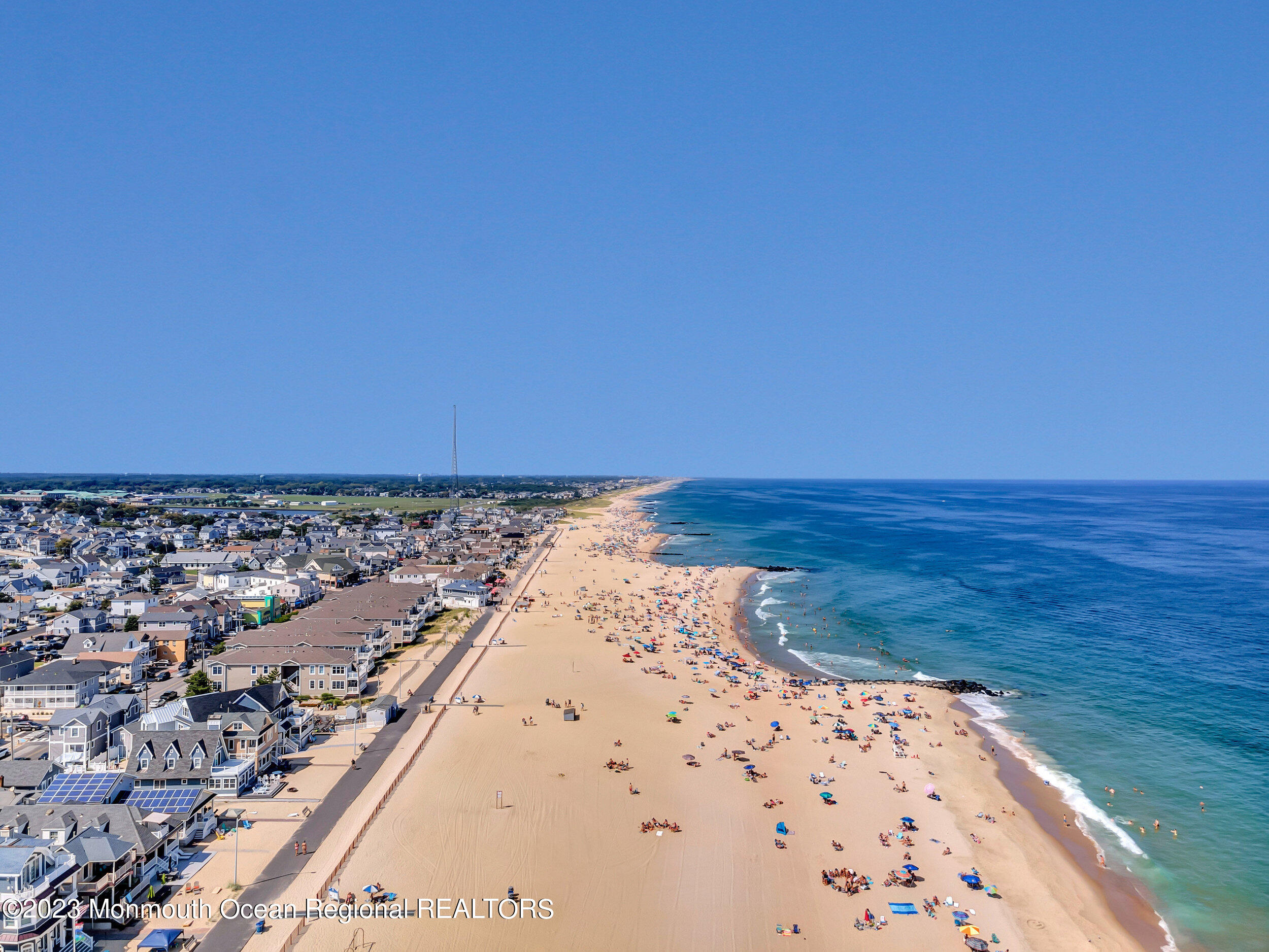 239 Beach Front, Unit 1 Manasquan, NJ 08736 - Photo 26 of 31 a view of an ocean beach