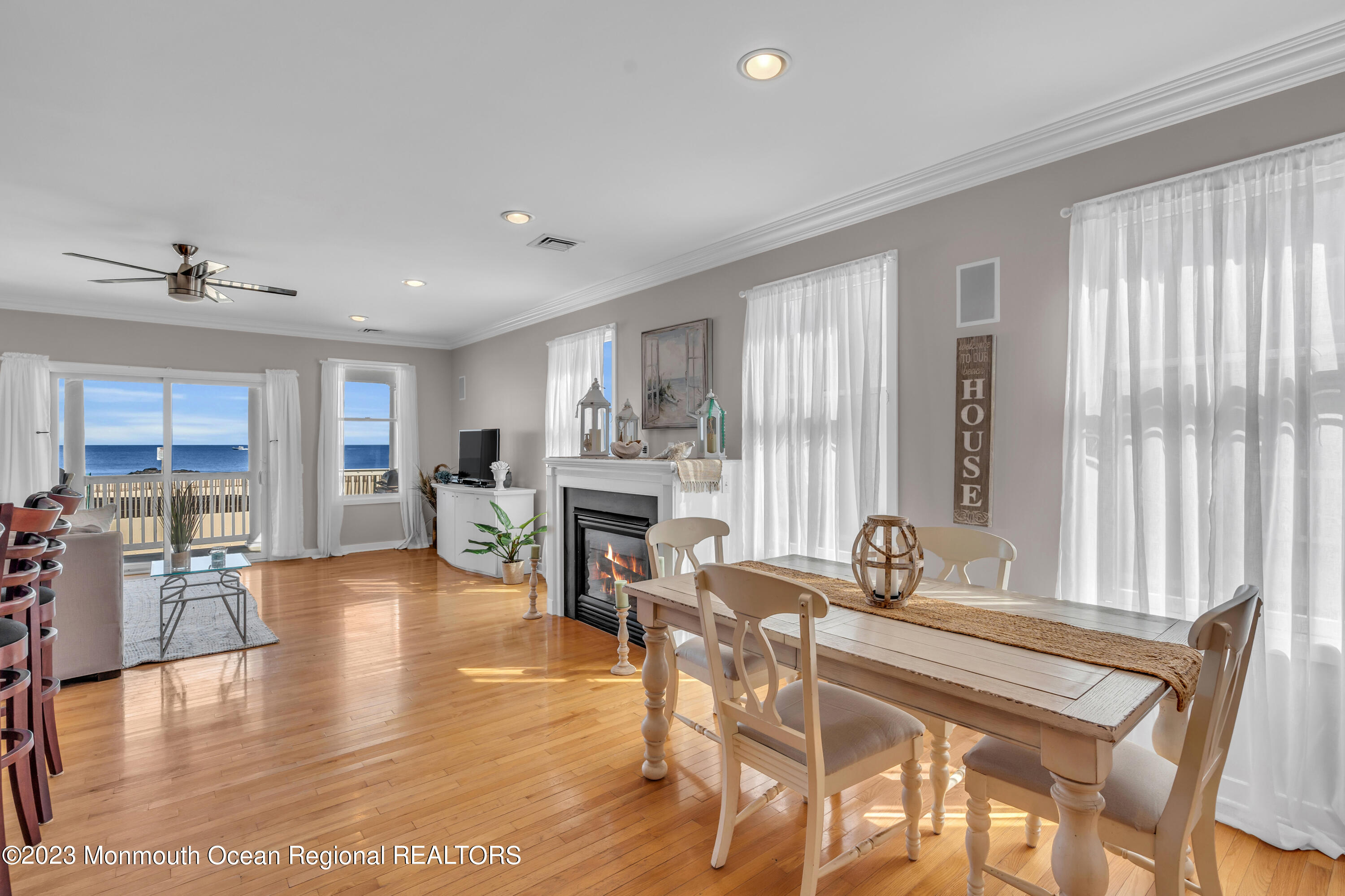 239 Beach Front, Unit 1 Manasquan, NJ 08736 - Photo 10 of 31 a dining room with furniture and wooden floor