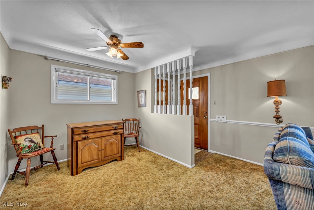 13732 Carpenter Road Garfield Heights, OH 44125 - Photo 11 of 46 Living area with light colored carpet and ceiling fan