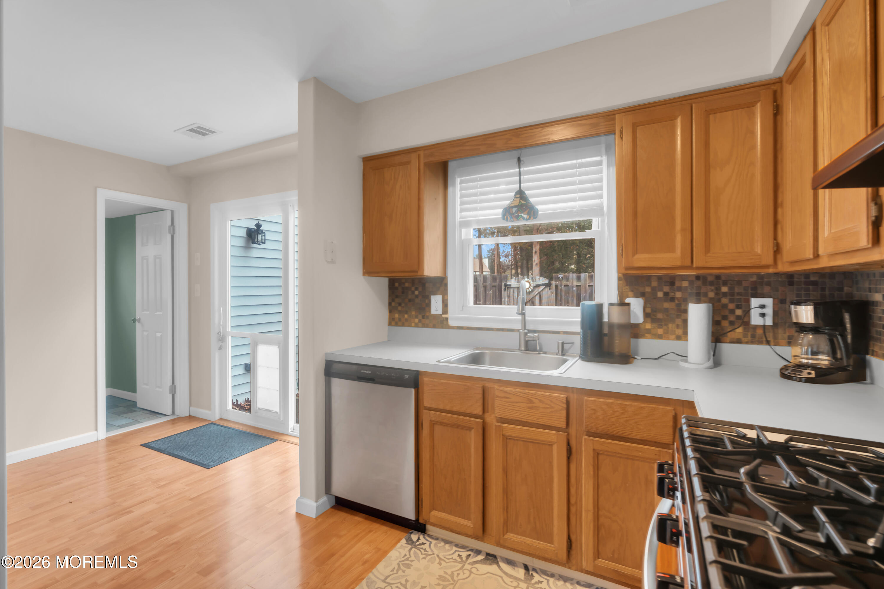 30 Shilling Way Jackson, NJ 08527 - Photo 14 of 28 a kitchen with stainless steel appliances granite countertop a sink stove and cabinets