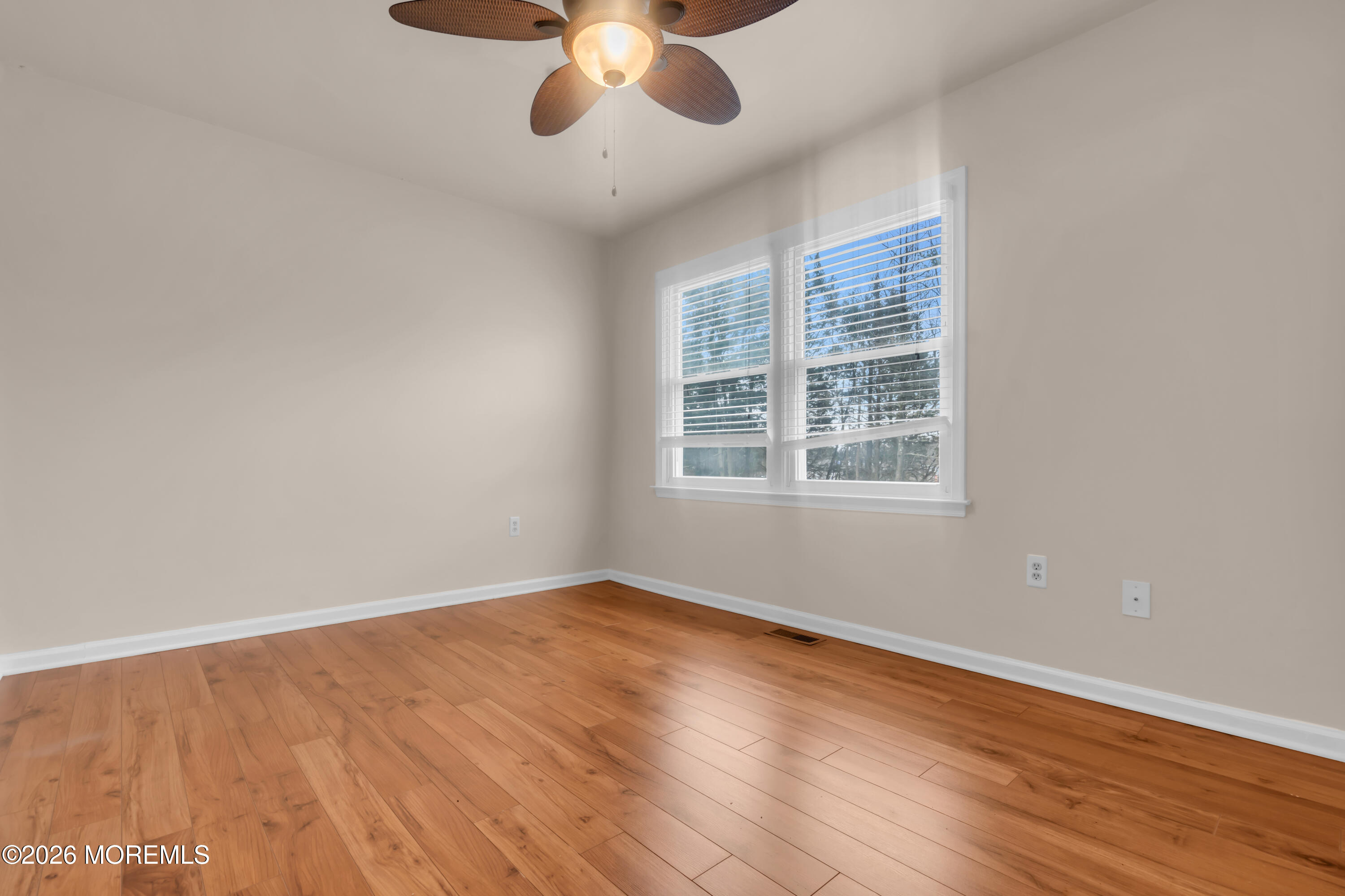 30 Shilling Way Jackson, NJ 08527 - Photo 22 of 28 a view of an empty room with wooden floor and a window