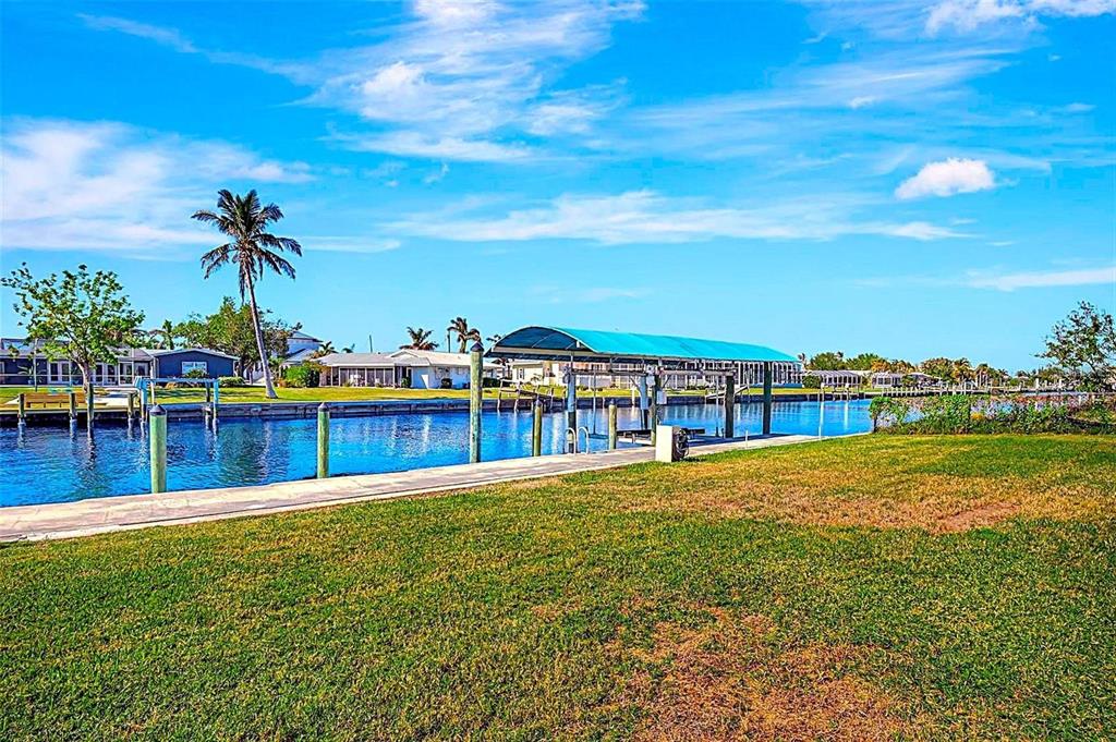250 Bangsberg Road Southeast Port Charlotte, FL 33952 - Photo 36 of 59 a view of a swimming pool with an outdoor seating