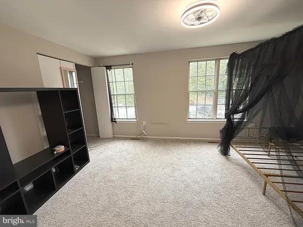 a view of an empty room with windows