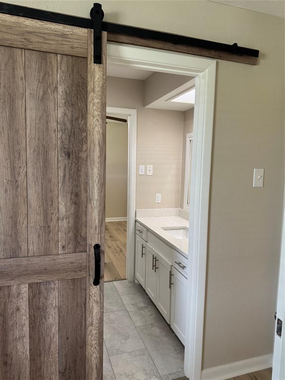 711 Farmington Road Howe, TX 75459 - Photo 16 of 21 a bathroom with a granite countertop sink and a mirror