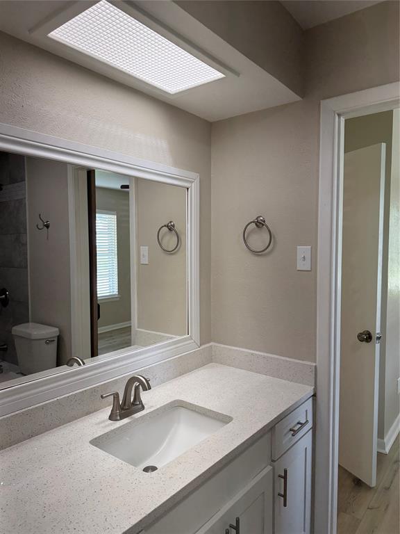 711 Farmington Road Howe, TX 75459 - Photo 18 of 21 a bathroom with a sink and a mirror