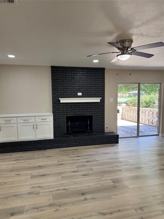 711 Farmington Road Howe, TX 75459 - Photo 3 of 21 a view of an empty room with a fireplace and a window
