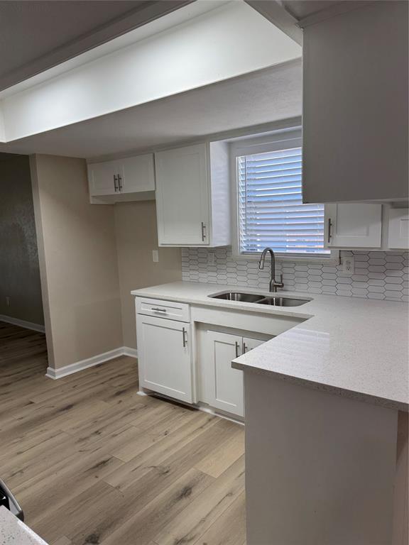711 Farmington Road Howe, TX 75459 - Photo 7 of 21 a kitchen with a sink stove and cabinets