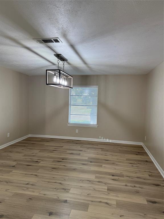 711 Farmington Road Howe, TX 75459 - Photo 10 of 21 a view of empty room with wooden floor