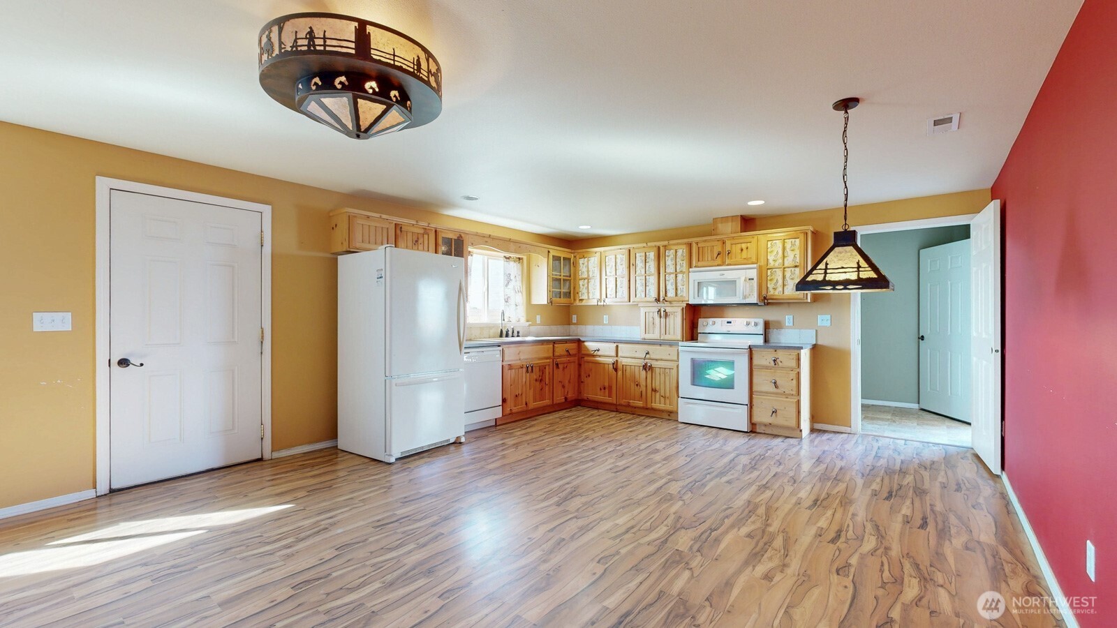 321 Kent Way Eltopia, WA 99330 - Photo 13 of 35 a kitchen that has a lot of cabinets and wooden floor