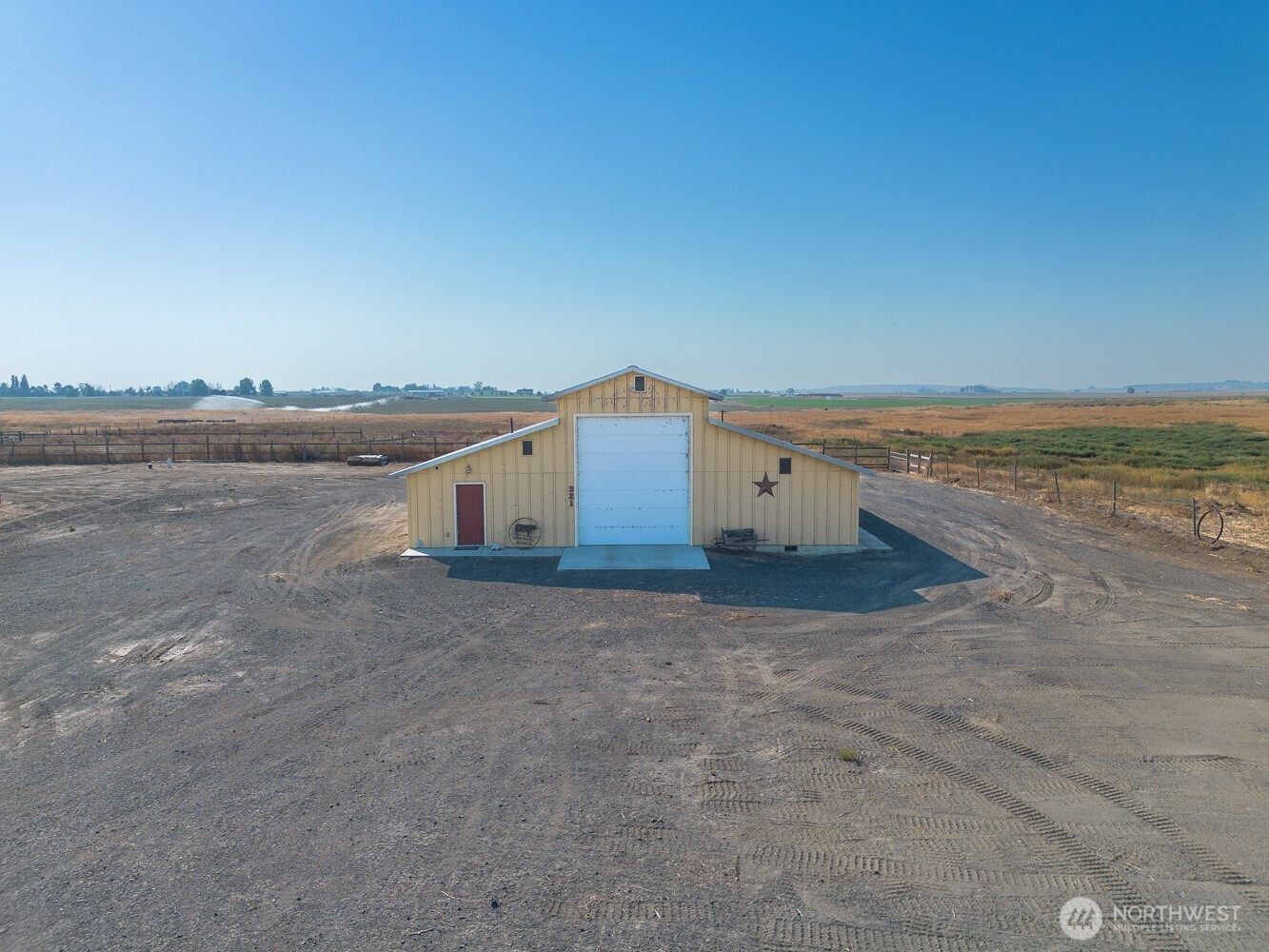 321 Kent Way Eltopia, WA 99330 - Photo 34 of 35 a view of a house with a yard