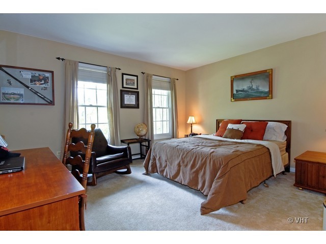 3530 Monarch Circle Naperville, IL 60564 - Photo 12 of 19 a bedroom with a bed and wooden floor