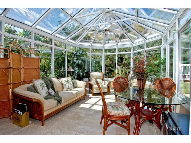 3530 Monarch Circle Naperville, IL 60564 - Photo 14 of 19 a view of a patio with table and chairs under an umbrella