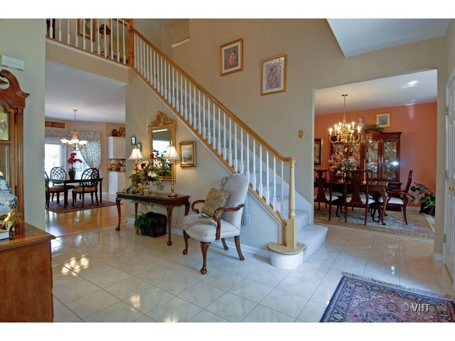 3530 Monarch Circle Naperville, IL 60564 - Photo 2 of 19 a view of a livingroom and dining room with furniture wooden floor and windows