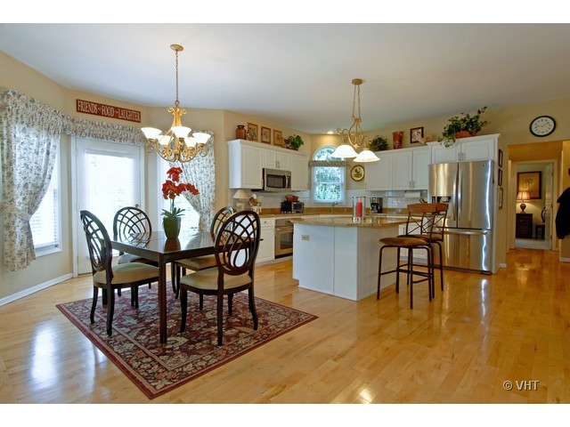 3530 Monarch Circle Naperville, IL 60564 - Photo 4 of 19 a dining room filled with furniture and chandelier