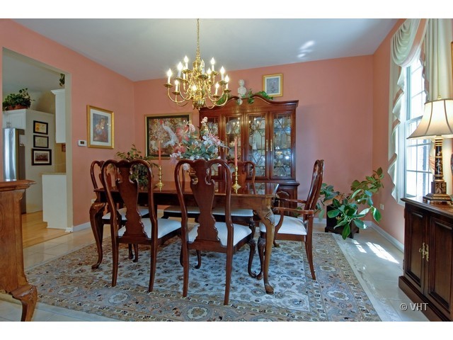 3530 Monarch Circle Naperville, IL 60564 - Photo 5 of 19 a view of a dining room with furniture and chandelier