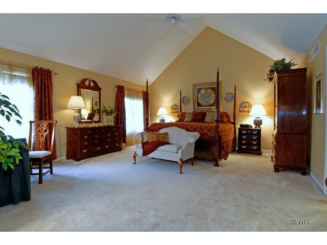 3530 Monarch Circle Naperville, IL 60564 - Photo 9 of 19 a bed room with furniture and a lamp