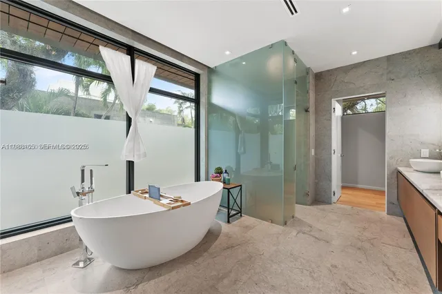 a bathroom with a bathtub and shower