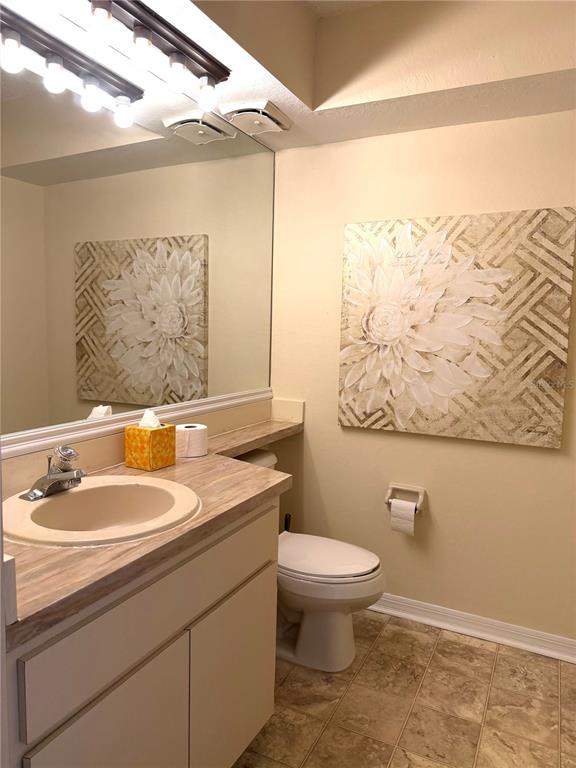 1340 Cypress Cove Court Inverness, FL 34450 - Photo 11 of 30 a bathroom with a toilet sink and mirror