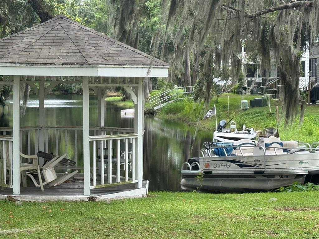 1340 Cypress Cove Court Inverness, FL 34450 - Photo 25 of 30 a view of a house with backyard tub and sitting area