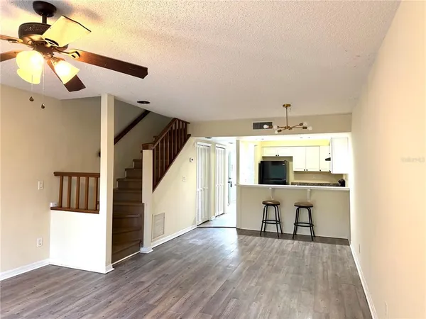 a view of a livingroom with furniture and wooden floor