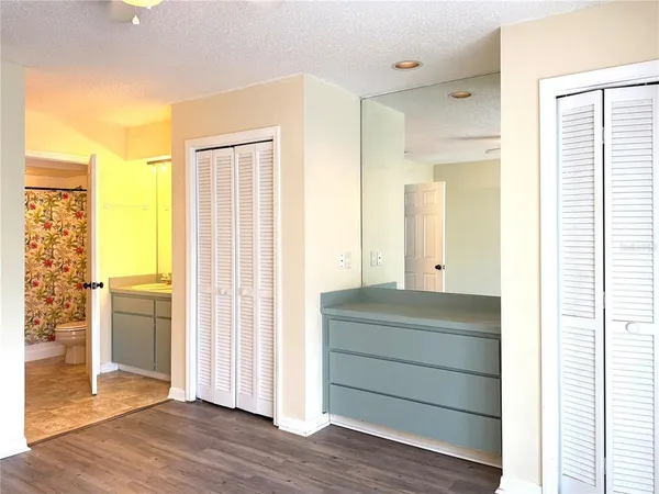 a room that has a dresser in it