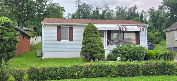 a view of a house with a garden