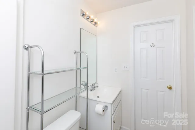 a bathroom with a shower a toilet and sink