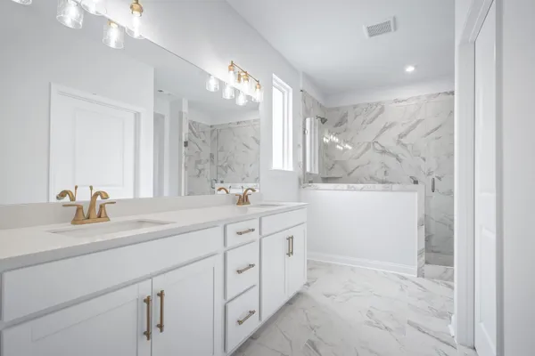 a bathroom with a sink double vanity and a mirror