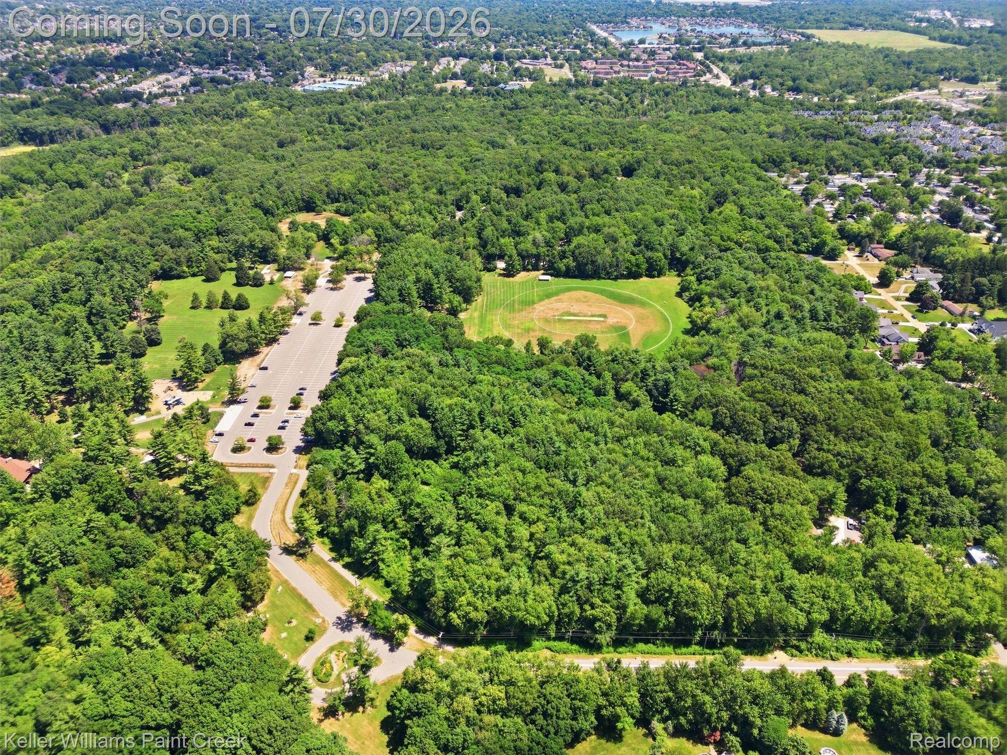 543 Arlington Drive Rochester, MI 48307 - Photo 53 of 59 Expansive aerial perspective showcasing a verdant landscape with dense tree cover