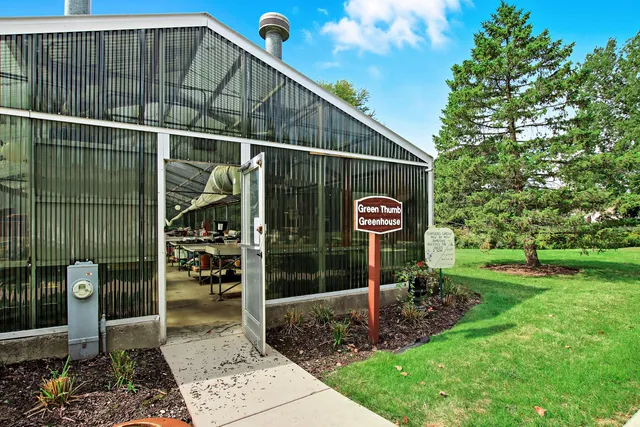 a view of a wooden house with a yard
