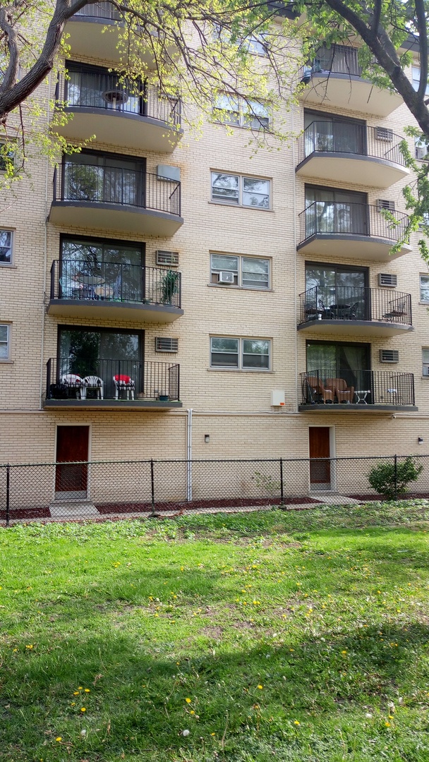 Undisclosed Address Chicago, IL 60630 - Photo 15 of 15 a front view of building with yard