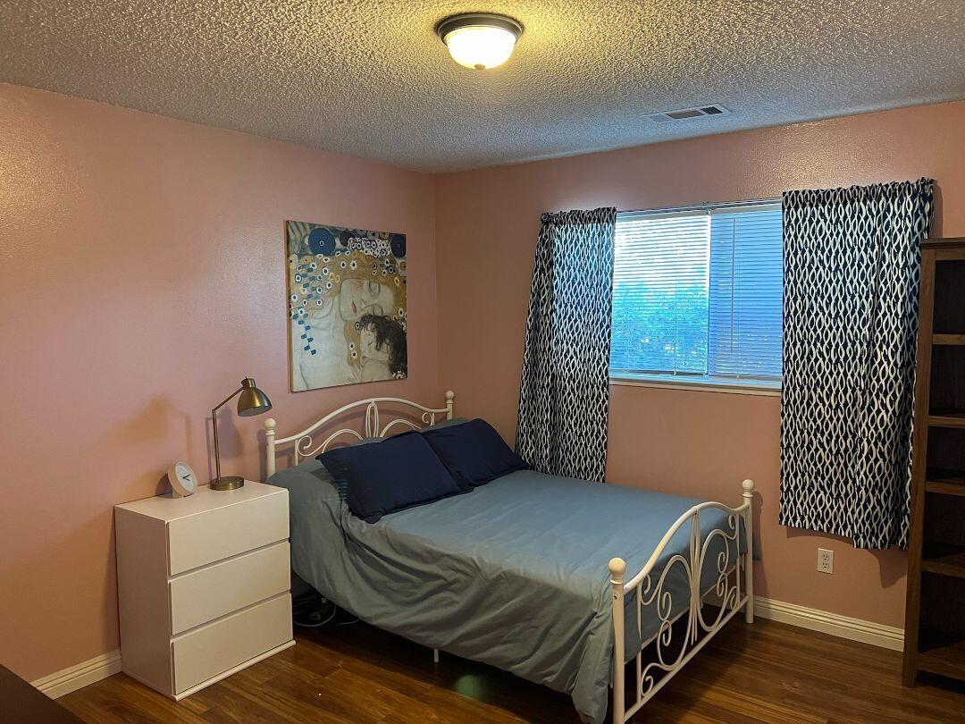 9733 Hidden Lane Palo Cedro, CA 96073 - Photo 17 of 63 a bedroom with a bed and a mirror