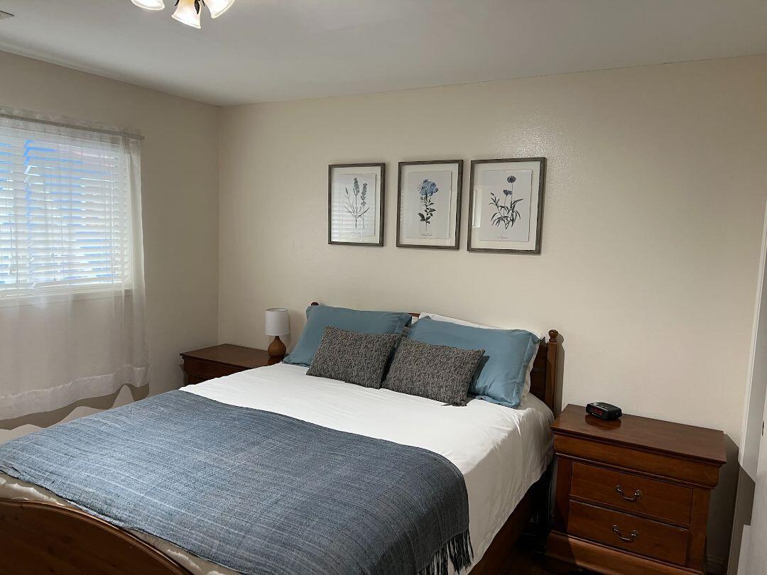 9733 Hidden Lane Palo Cedro, CA 96073 - Photo 25 of 63 a bedroom with a bed and a window