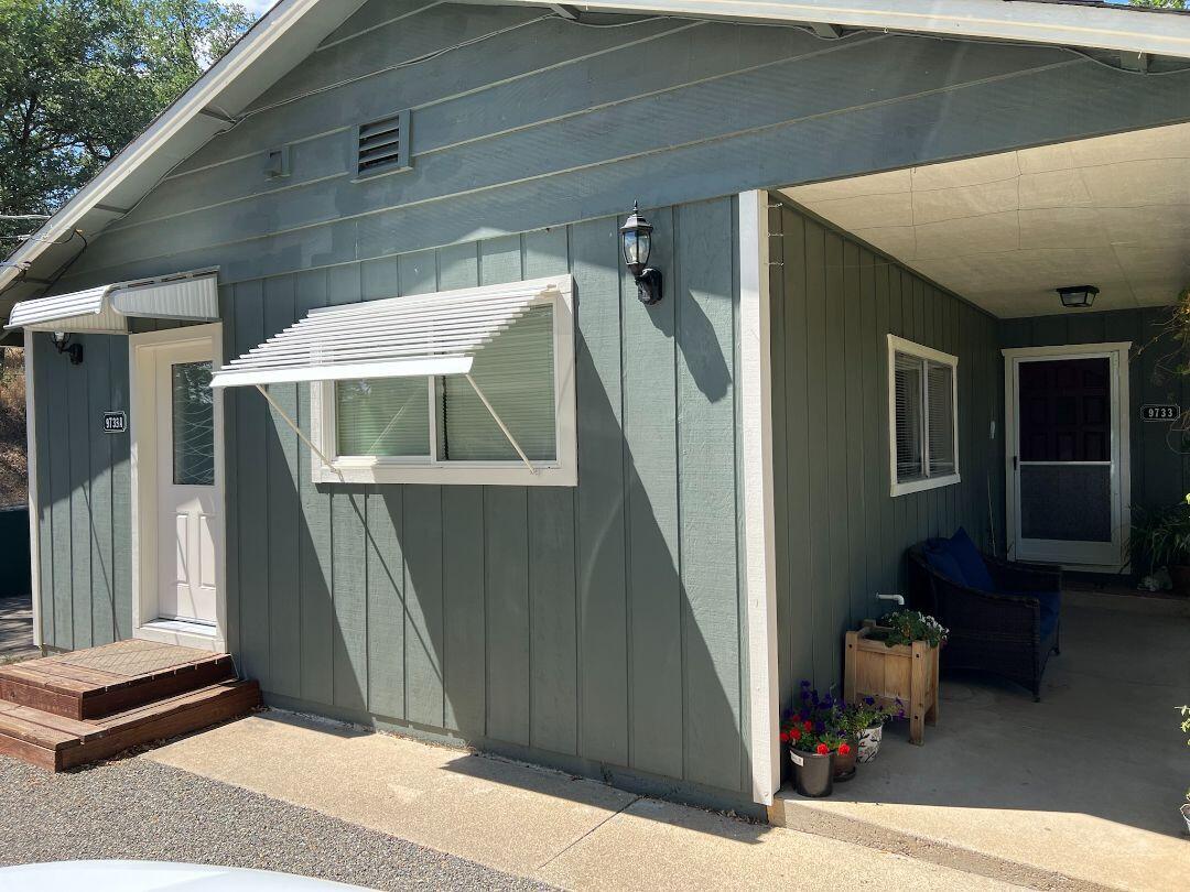 9733 Hidden Lane Palo Cedro, CA 96073 - Photo 51 of 63 a front view of a house with entryway