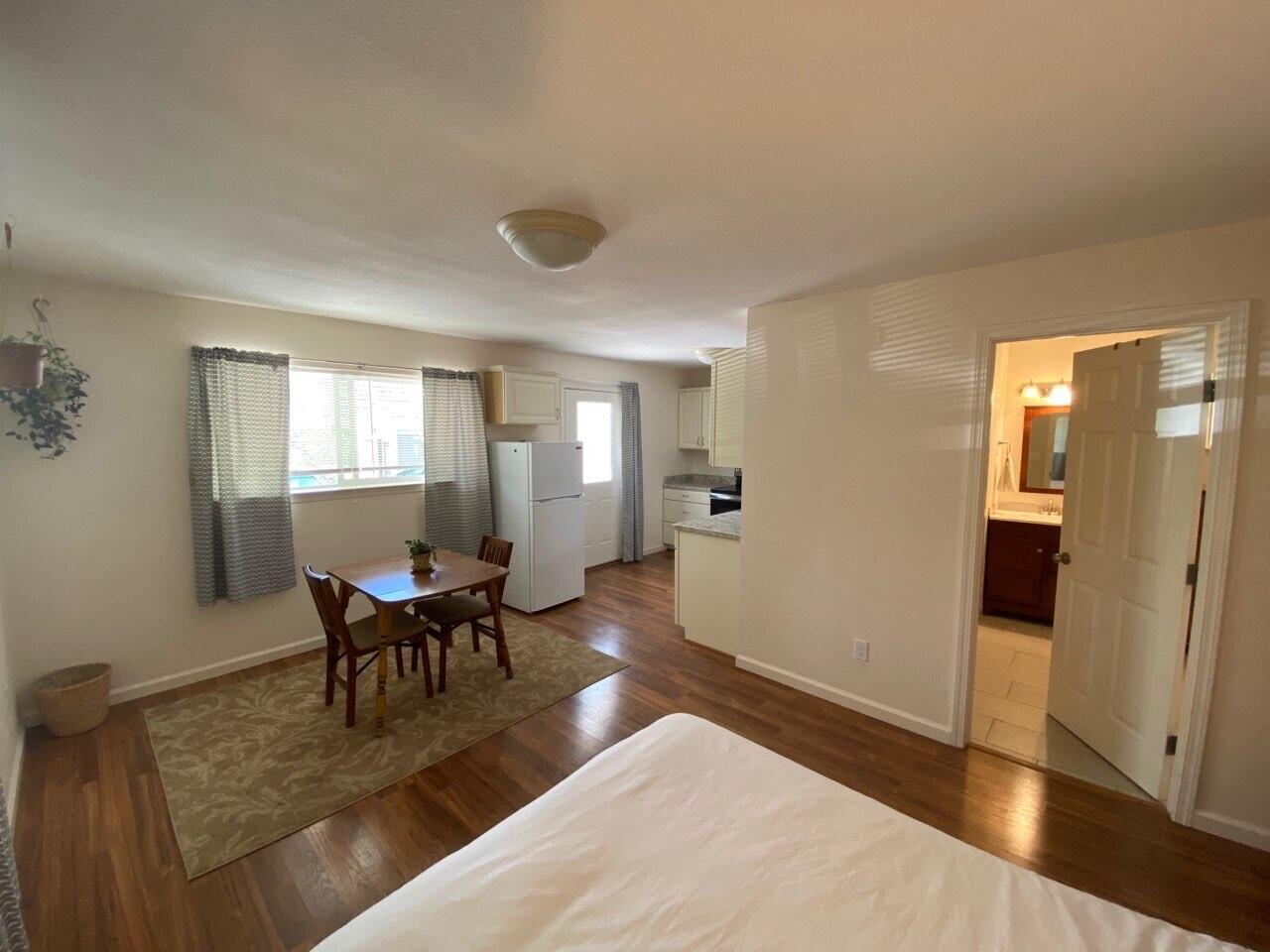 9733 Hidden Lane Palo Cedro, CA 96073 - Photo 52 of 63 a view of a livingroom with furniture and wooden floor