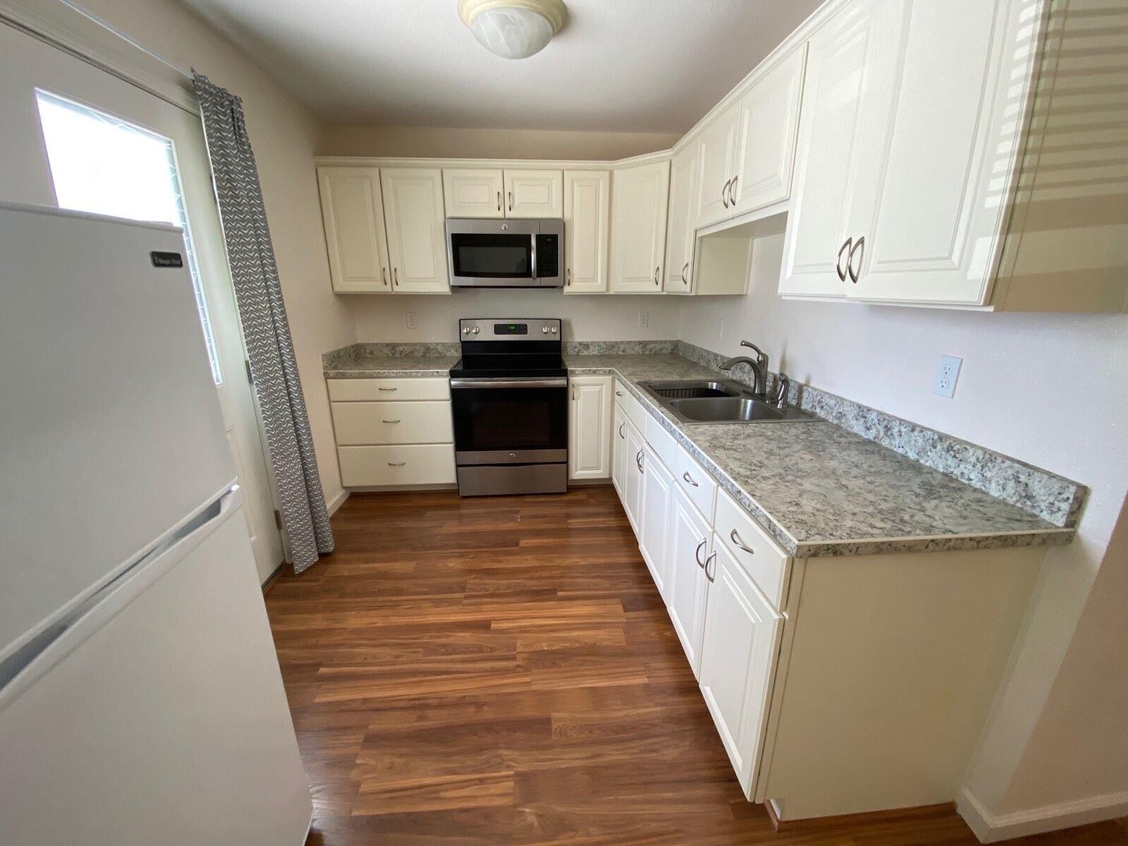 9733 Hidden Lane Palo Cedro, CA 96073 - Photo 54 of 63 a kitchen with granite countertop a sink and steel appliances