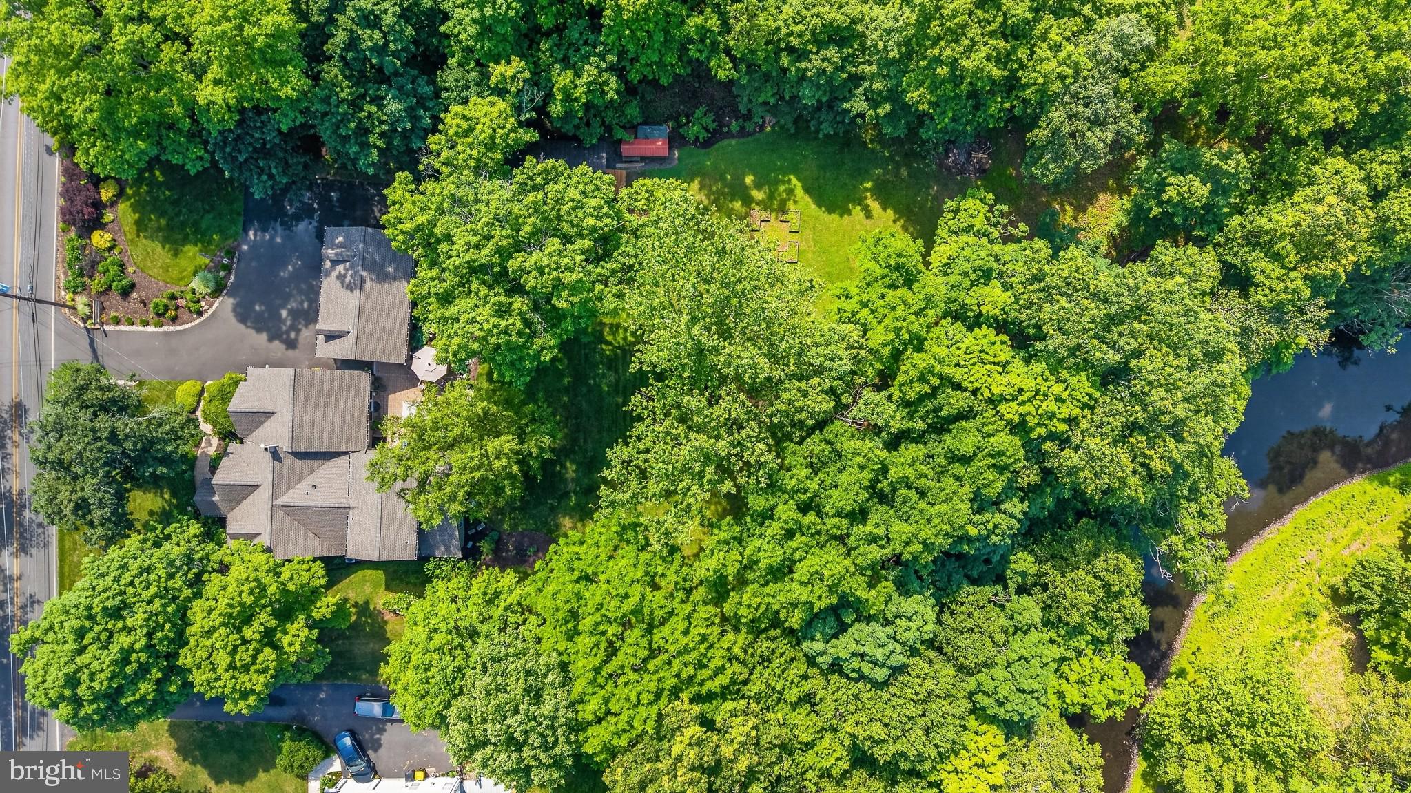 460 Wells Road Doylestown, PA 18901 - Photo 49 of 65 Lush greenery surrounds a serene home.