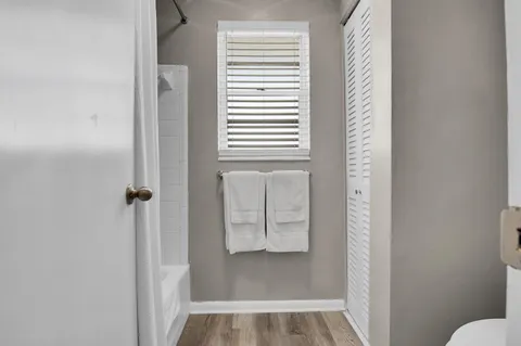 a view of a bathroom from a hallway